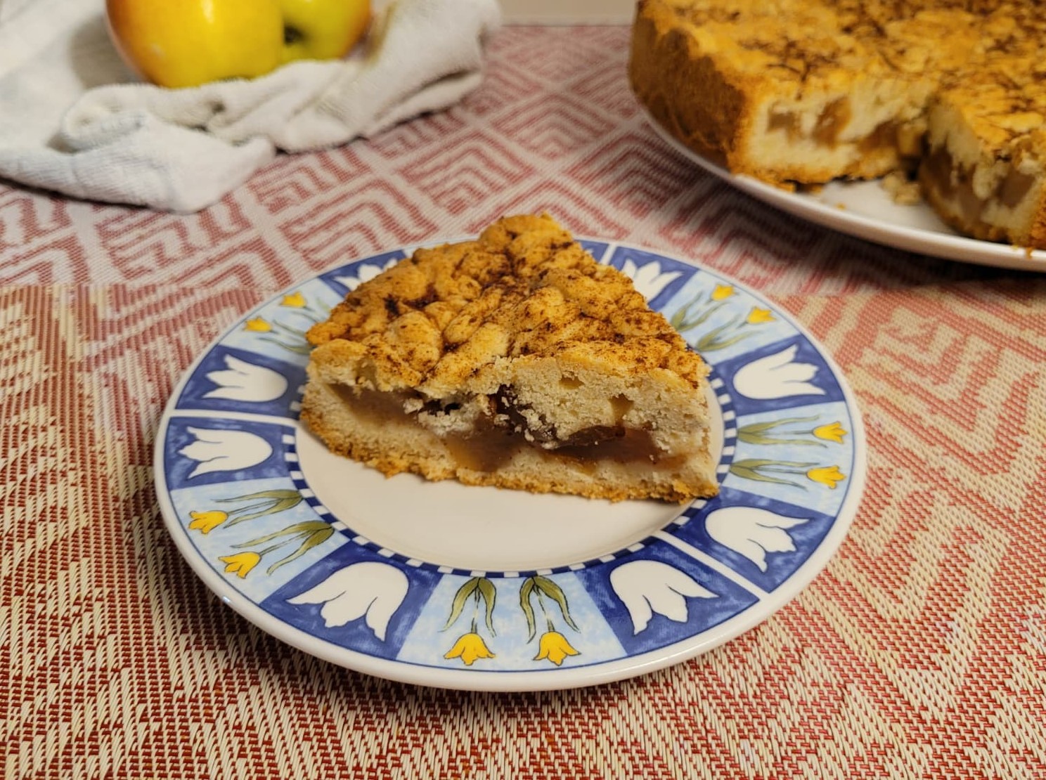 Close-up of homemade apple pie with soft apple filling and cinnamon